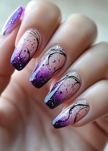 Elegant purple gradient nail art with intricate designs and shimmering glitter accents.