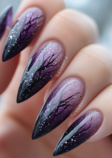 Stunning purple gradient stiletto nails with tree branch designs and sparkling glitter accents.