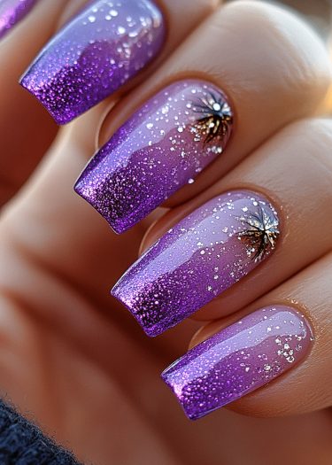 Elegant purple ombre nails with glitter and intricate designs for a luxurious manicure look.