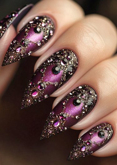 Luxurious purple stiletto nail art with intricate rhinestones and shimmering embellishments.