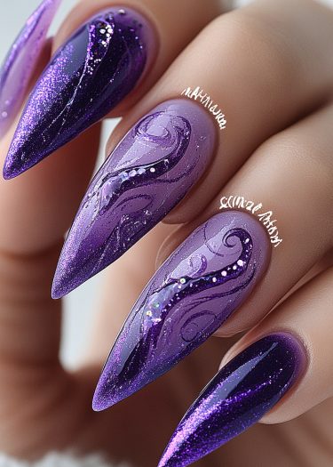 Stunning purple stiletto nails featuring intricate designs, glitter, and rhinestones for a glamorous look.