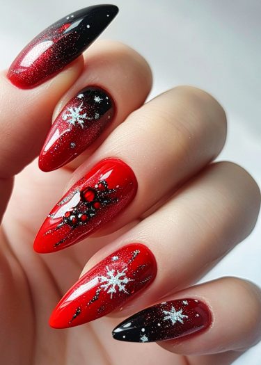 Glamorous red and black stiletto nails with snowflake designs for festive occasions.