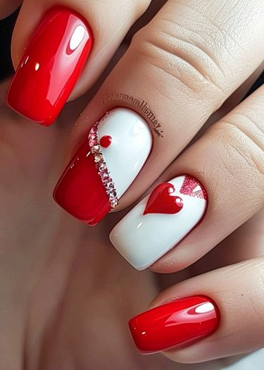 Stunning red and white nail art with intricate designs and glossy finishes.