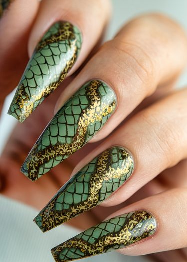 Elegant coffin-shaped nails with mossy green reptile scale design and gold filigree accents.