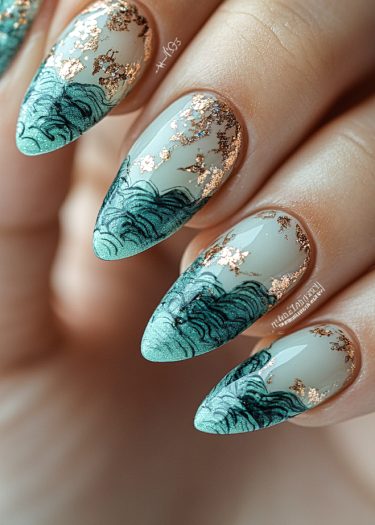 Elegant sage green almond nails with gold foil accents and intricate wave designs.