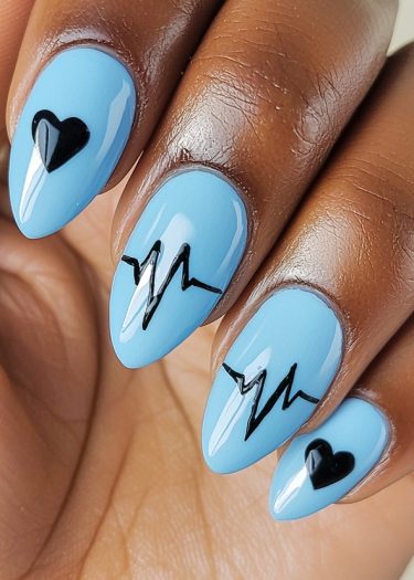 Elegant sky blue nails with black heart designs for sophisticated nail art lovers.