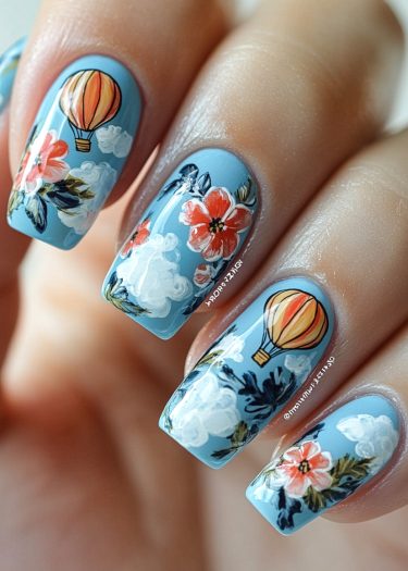 Artistic sky-blue nail art with hot air balloons, flowers, and clouds for a whimsical look.