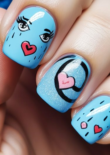 Whimsical sky-blue nail art featuring cartoon eyes and hearts for a playful manicure look.