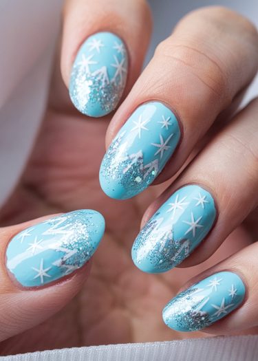 Vibrant turquoise winter-themed nail art with white stars and silver glitter accents.