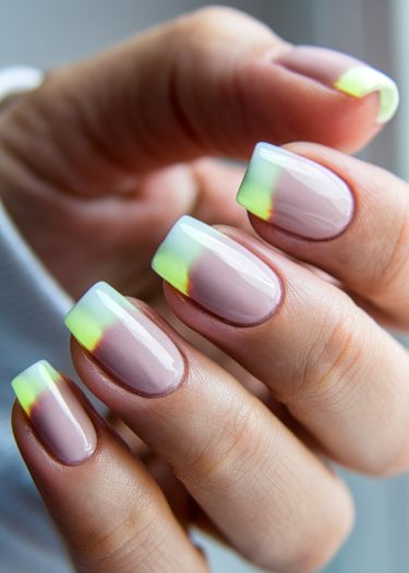 Sophisticated mauve nails with a stylish lime green gradient French tip design.