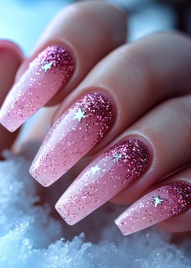 Elegant soft pink glitter nail art with star sequins against a snowy backdrop.