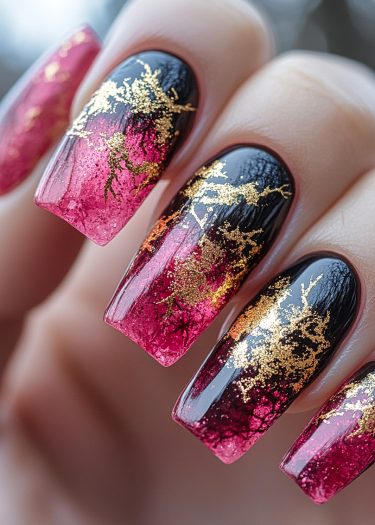 Elegant black and pink ombre nails with gold leaf detailing in a coffin shape.