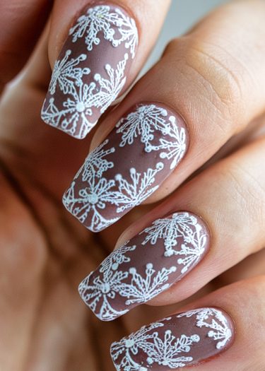 Elegant taupe nail art featuring intricate lace designs for a sophisticated manicure.