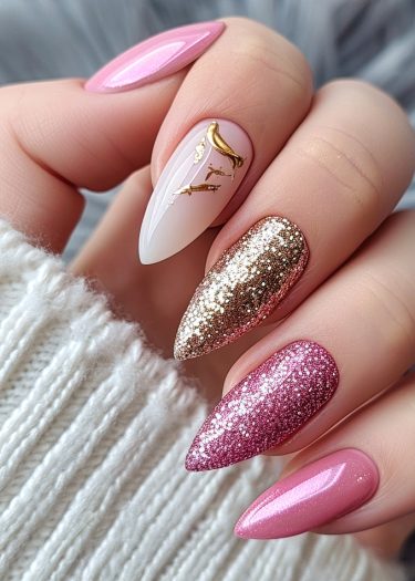 Elegant almond-shaped nails featuring gold glitter and soft pink hues for sophisticated nail art.