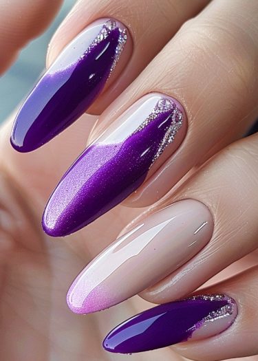 Elegant purple and nude gradient nail art with glitter accents for a sophisticated look.