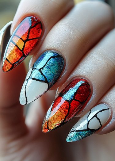 Vibrant stained-glass nail art design with intricate patterns and bold colors on almond-shaped nails.