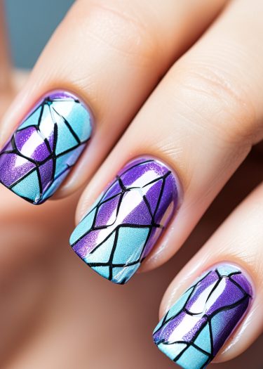 Intricate stained glass nail art featuring turquoise and purple designs with bold black outlines.