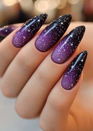 Elegant starry night nail art with black-purple gradient and celestial designs on classy almond nails.