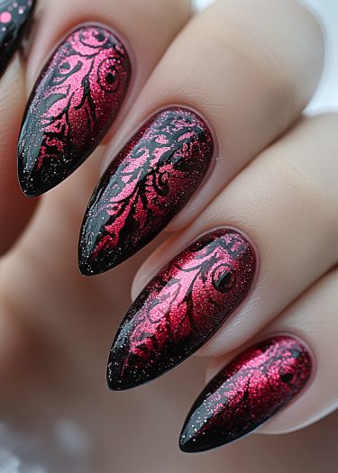 Elegant stiletto nails with black base and metallic magenta glitter design for a stunning look.