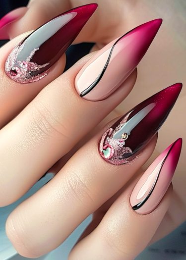 Elegant stiletto nails featuring a burgundy to nude gradient with intricate designs and sparkling details.