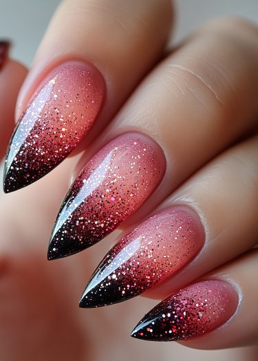 Elegant stiletto gradient nails with glitter for a glamorous and sophisticated manicure.