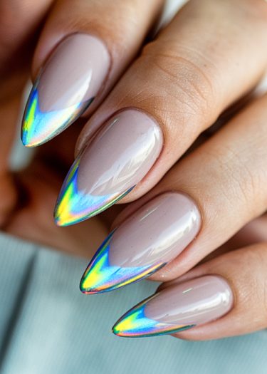 Elegant stiletto mauve nails with stunning holographic tips in a close-up view.