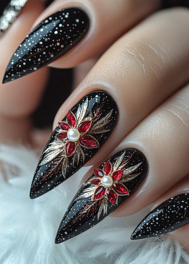 Gorgeous black stiletto nails adorned with red gemstones and starry designs for elegant nail art.