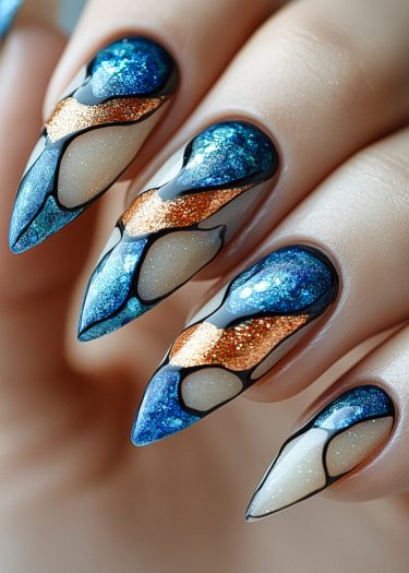 Stunning long almond-shaped nails featuring blue and copper nail art with intricate designs.