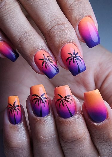 Tropical sunset gradient nails with palm tree designs for a vibrant beach-inspired look.