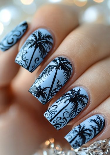 Intricate tropical palm tree nail art on a serene blue background.