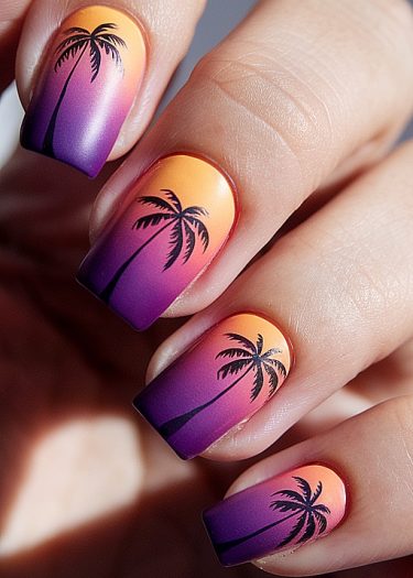 Tropical sunset nail art featuring gradient colors and palm tree silhouettes for a serene look.