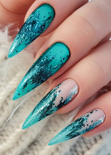 Vibrant turquoise gradient stiletto nails with glitter, perfect for elegant nail art.