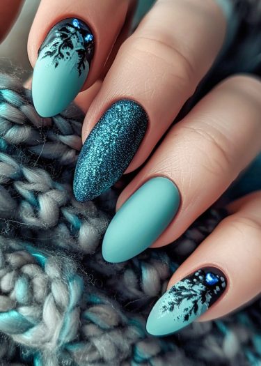 Elegant turquoise matte nail art with botanical designs and glittering teal accents on a cozy background.