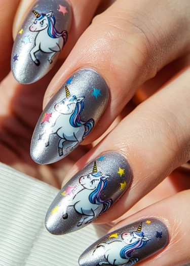 Whimsical unicorn nail art with metallic silver polish and colorful star accents.