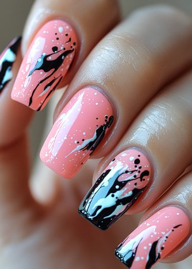 Elegant pastel pink nail art with bold black and white abstract designs.