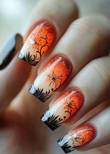 Vibrant floral nail art features a stunning orange-beige gradient with intricate black designs.