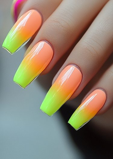 Vibrant ombre coffin nails featuring neon green and peach colors for stylish nail art.