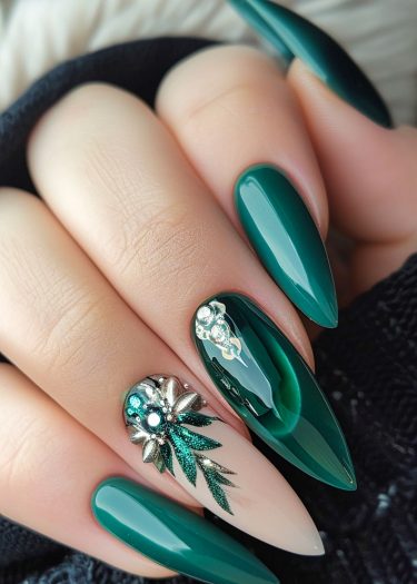 Elegant dark green nail art with intricate designs and sparkling embellishments for a chic look.