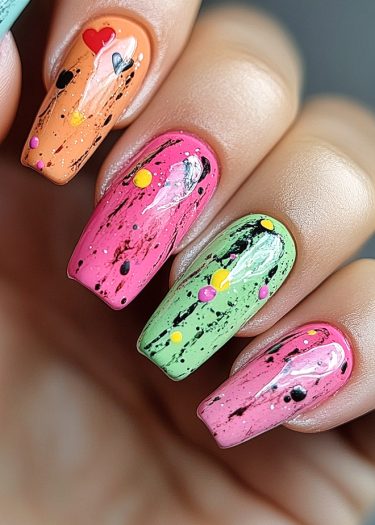 Vibrant nail art featuring colorful designs, glossy finishes, and playful heart embellishments.