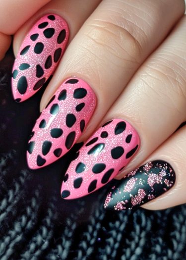 Elegant pink and black leopard nail art with unique patterns and textures for a bold look.