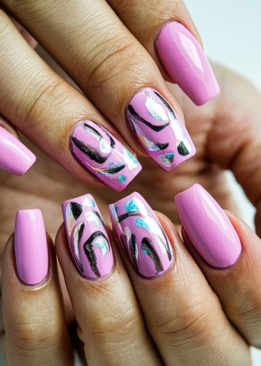 Vibrant pink nail art with intricate designs and glossy finish showcases modern manicure style.