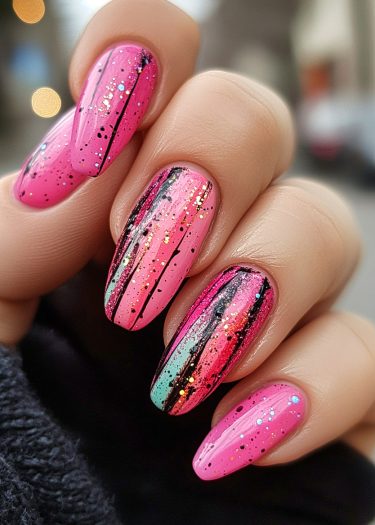 Vibrant pink nail art with glitter, black lines, and aqua accents on long almond nails.