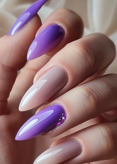 Elegant lavender and nude manicure with crystals on almond-shaped nails.