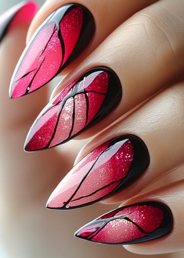 Elegant pink ombre nail art with intricate black designs and a glossy finish.