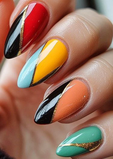 Vibrant almond-shaped nails with artistic glossy finishes and gold accents in bold colors.