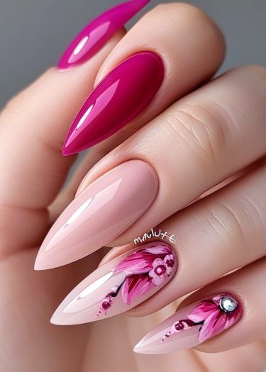 Vibrant stiletto nails with floral designs and glossy magenta accents for stunning nail art.