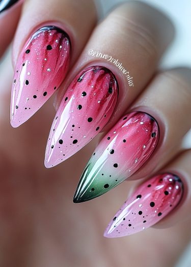 Vibrant watermelon-themed stiletto nails with pink gradients and seed designs for a playful look.