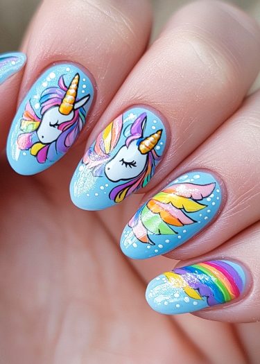 Whimsical unicorn nail art with rainbows on a light blue background showcases vibrant fantasy designs.