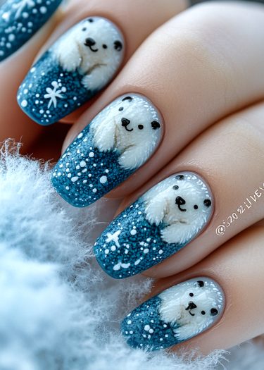 Adorable polar bear nail art on textured blue background, perfect for winter-themed designs.