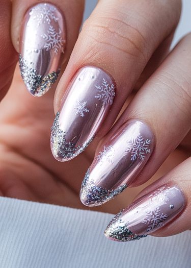 Elegant winter-themed stiletto nails with rose-gold polish and intricate snowflake designs.